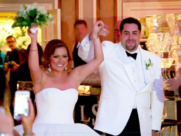 lauren manzo and vito scalia smiling and celebrating after exchanging wedding vows 