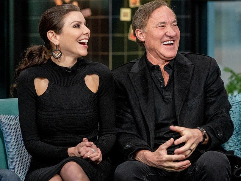 Heather Dubrow and Terry Dubrow laugh together during interview
