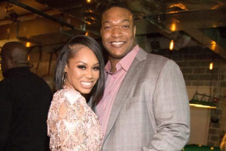 RHOP alums Monique Samuels and Chris Samuels smile during happier days of their marriage