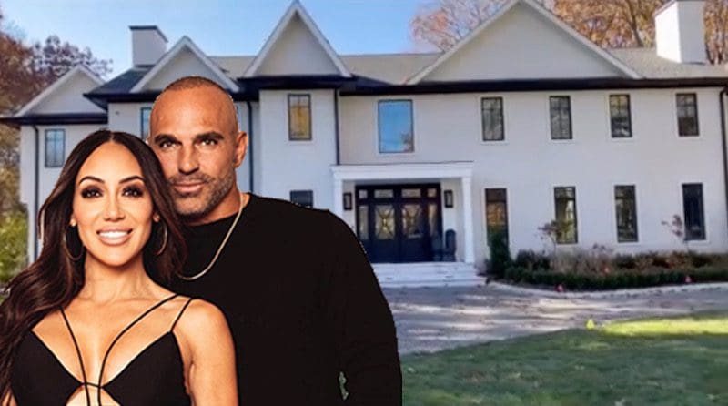 Melissa and Joe Gorga pose in front of their new Franklin Lakes home
