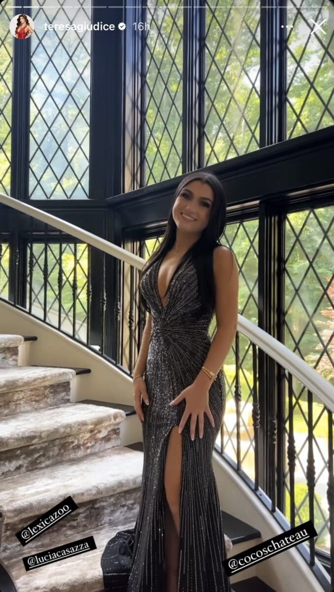 Gabriella Giudice poses for photo before prom on staircase.