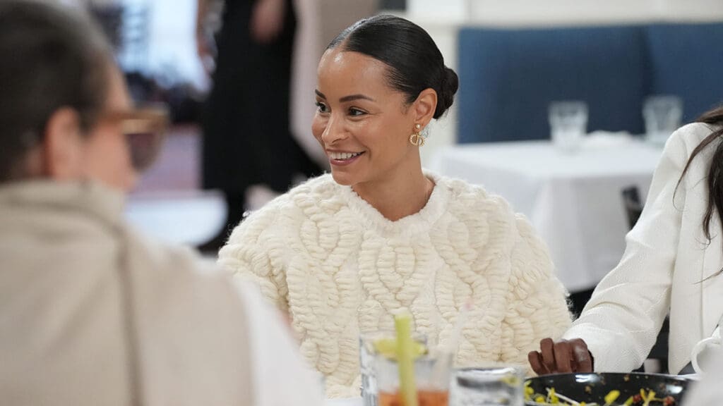 Sai de Silva wears white sweater dress at lunch in the Hamptons