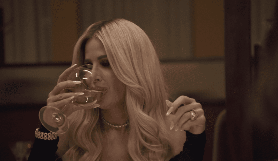 RHOA OG Kim Zolciak drinking wine while appearing on a recent episode