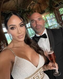The RHONJ couple pose for a selfie at a Marco family wedding.