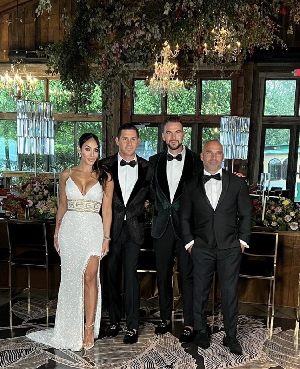 RHONJ's Melissa and Joe Gorga pose with grooms at family wedding.